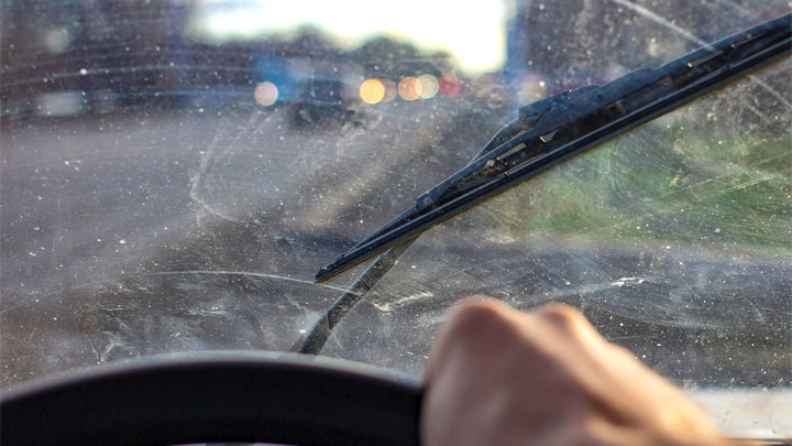 what causes windshield scratches